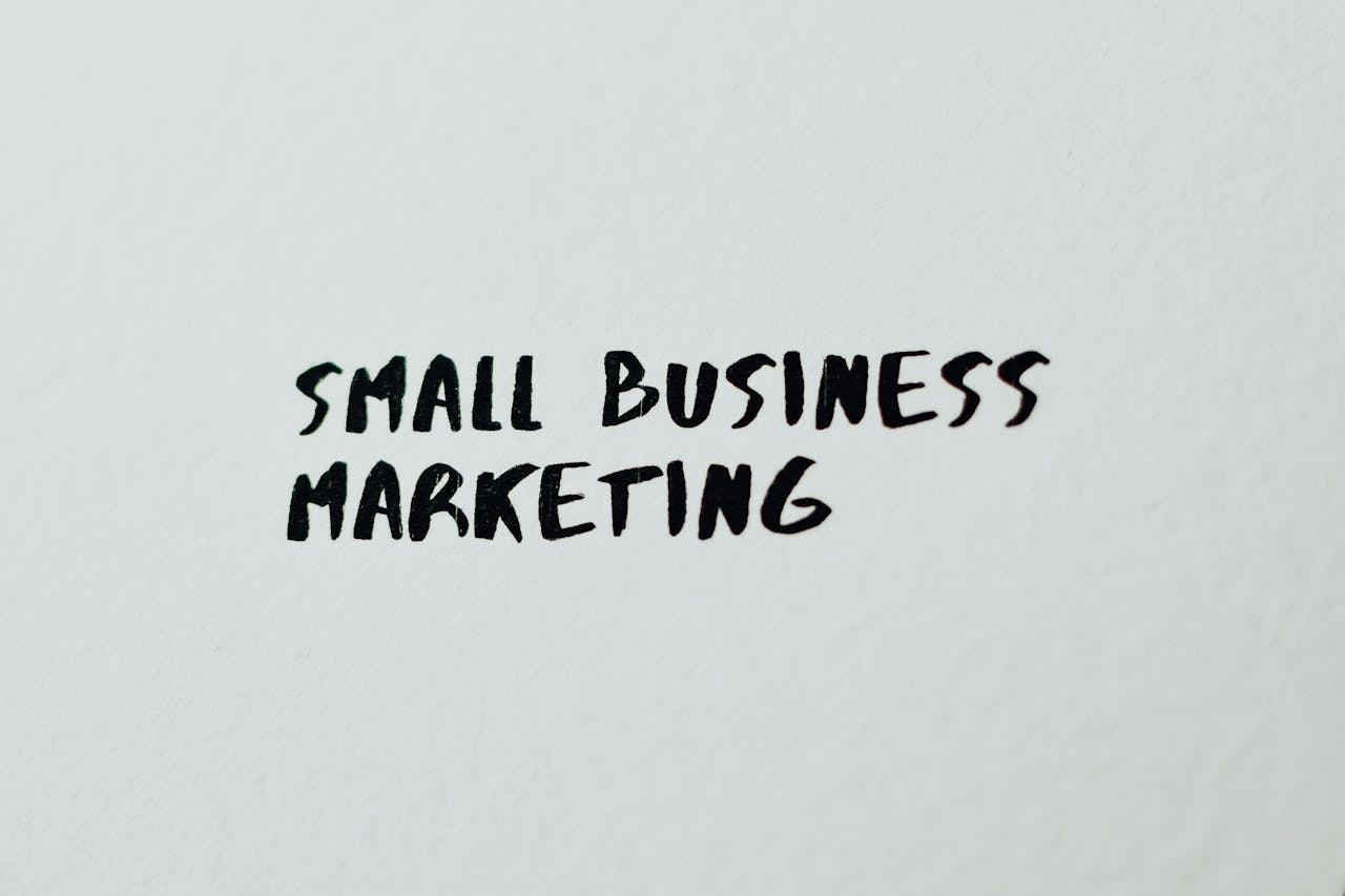 Text 'Small Business Marketing' written on white paper for creative use.